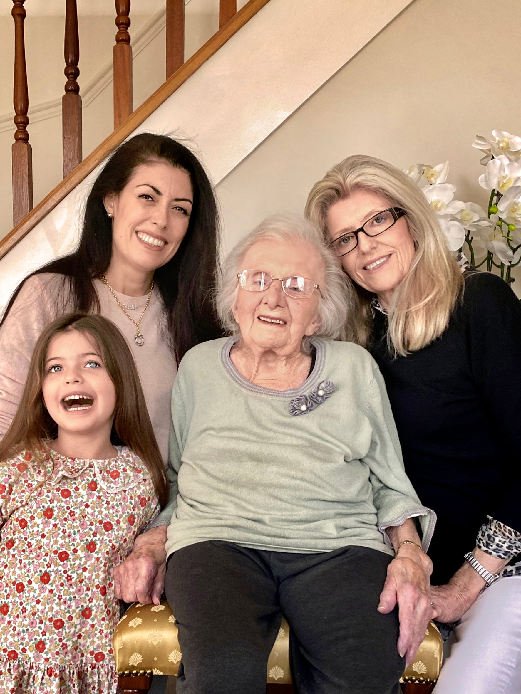 Four generations of the family on a staircase: Sienna, Chantel, her grandmother Joan and her mother Libby
