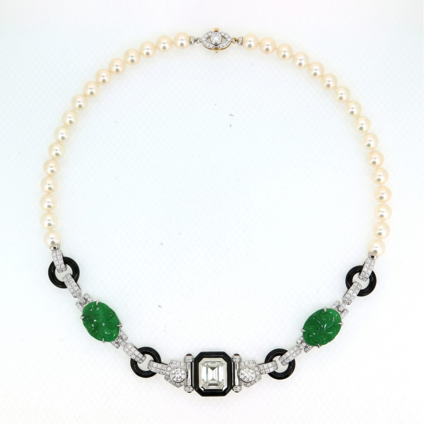 The finished necklace of pearls, black onyx, carved jade and diamonds