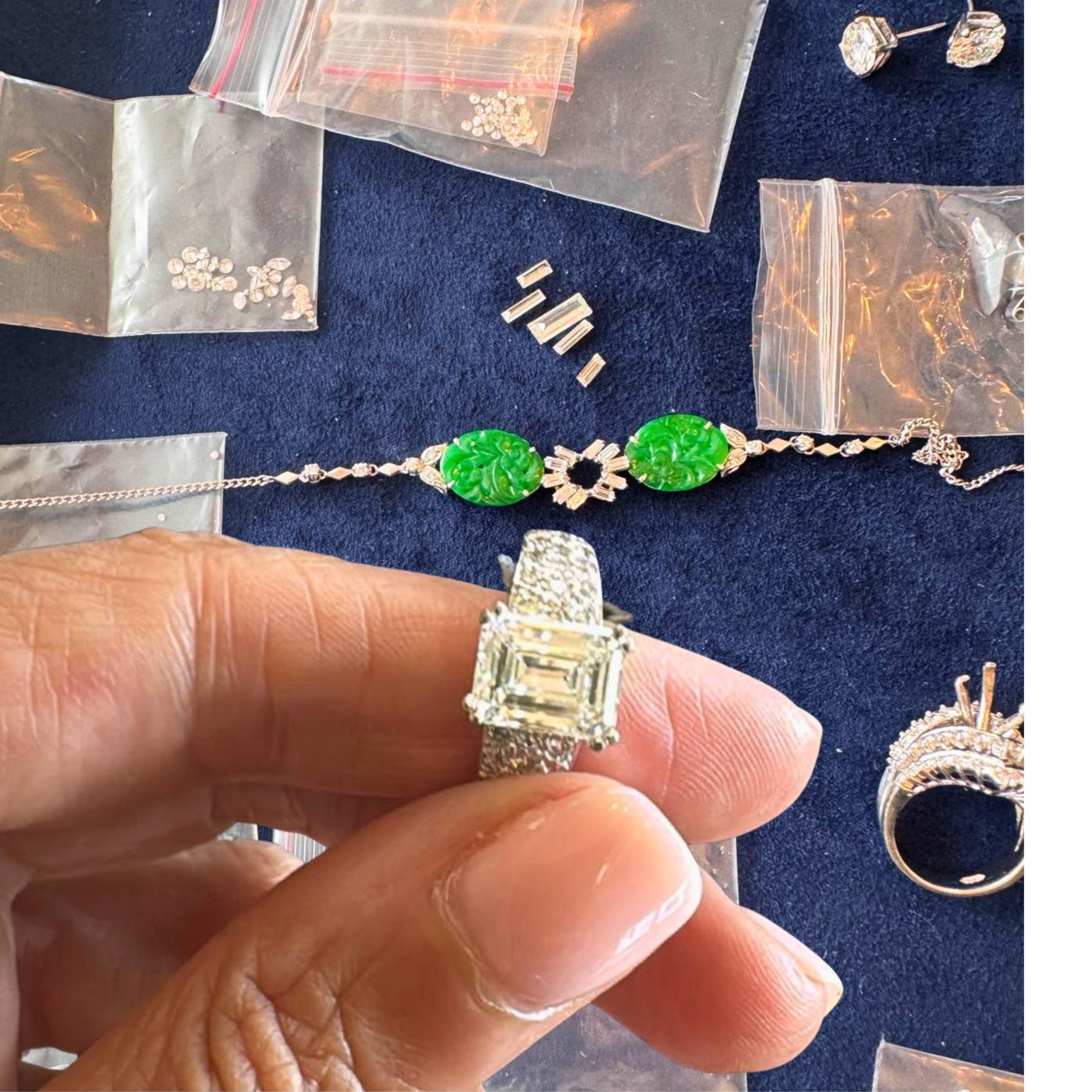 Unworn jewellery, a diamond ring and carved jade pieces