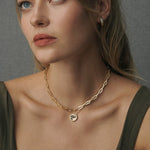 Ravello hoop earrings worn with Ravello torque