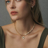 Ravello hoop earrings worn with Ravello torque